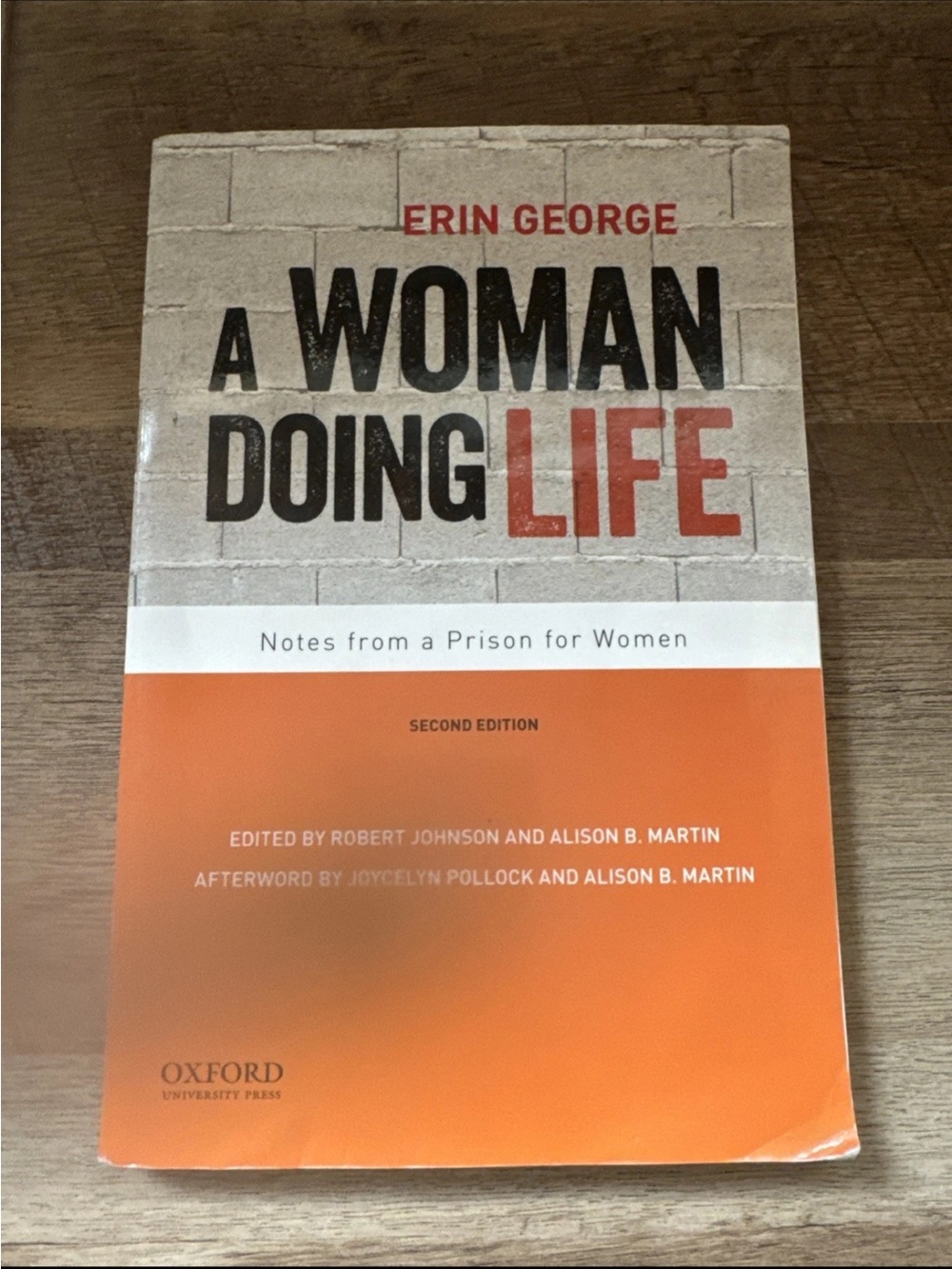 A Woman Doing Life Paperback Back Cover - Orange & Cream